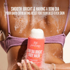 Person using Sol de Janeiro Bom Dia Bright Body Wash with text about skin care benefits.