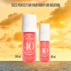 Two perfume bottles with a sunset background