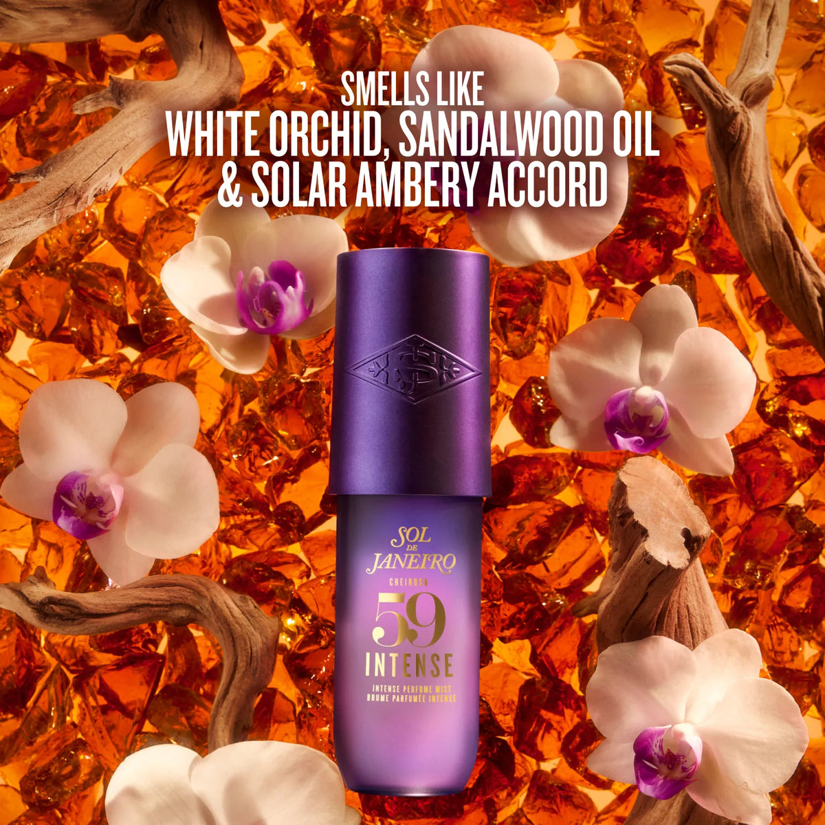 A purple bottle of Sol Janeiro SPF 59 Intense sunscreen centered against a warm orange background of amber glass, white orchids, and driftwood. White text at the top reads: 'SMELLS LIKE WHITE ORCHID, SANDALWOOD OIL & SOLAR AMBERY ACCORD'.
