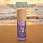 Bottle of Sol Janefro Cheirosa 59 perfume on a beach with sunset background