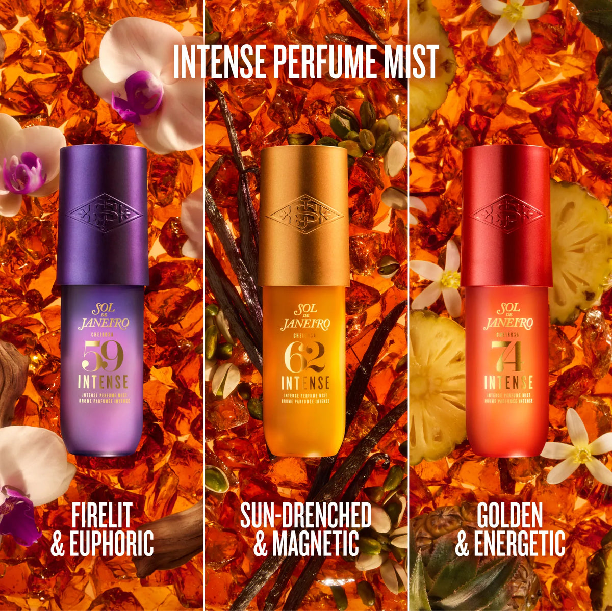 Three perfume mist bottles from SOL JANHEIRO are displayed side-by-side against a rich background of orange flower petals, vanilla beans, and white orchids. The bottles feature metallic purple, gold, and red finishes with gold lettering, labeled 'INTENSE PERFUME MIST' at the top and three scent names at the bottom: 'FIRELIT & EUPHORIC', 'SUN-DRENCHED & MAGNETIC', and 'GOLDEN & ENERGETIC'.