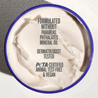 Jar of cream with certification text on a neutral background