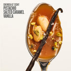 A spoonful of Cheirosa 62 Scent Pistachio Salted Caramel Vanilla fragrance, featuring rich amber-brown caramel sauce, whole pistachios, and a dark vanilla bean on a clean off-white background with text on the top left.